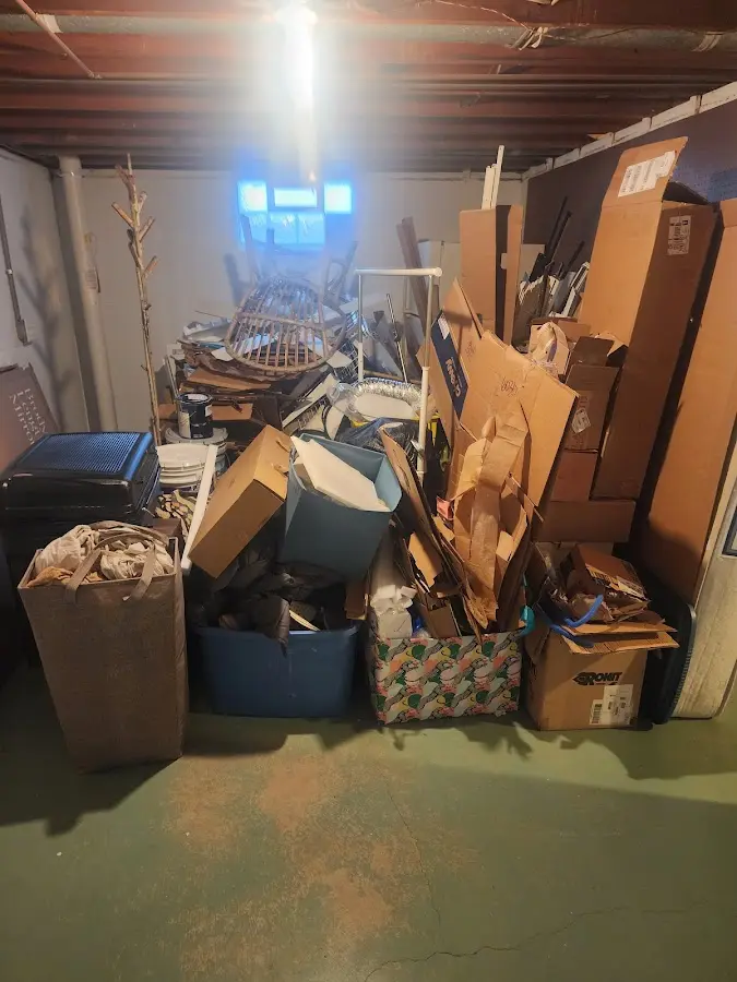 Roll-off dumpster container at job site for 2 Yard Dumpster Rental in Chestnut Ridge